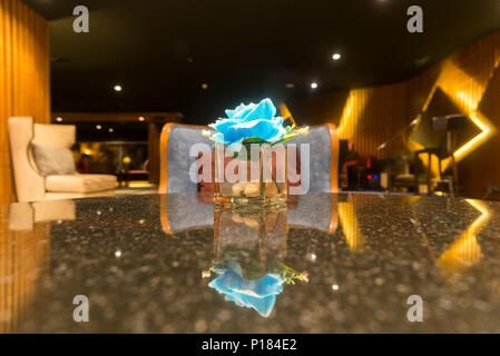 Luxury sofas in the hotel's guest lounge with night lighting. Stock Photo