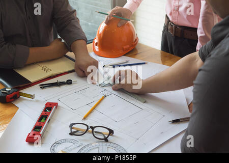 Engineer and Architect concept, Engineer Architects and real estate agent office team working with blueprints Stock Photo
