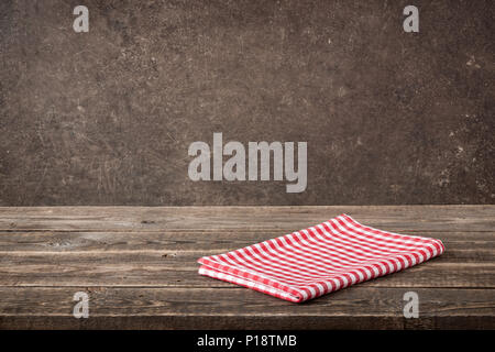Red-white checkered napkin on wooden table Stock Photo