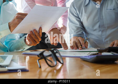Business team meeting and discussing project plan. Businessmen discussing together in meeting room. Professional investor working with business projec Stock Photo