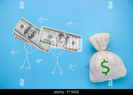 people take money from the big bag. expences concept Stock Photo