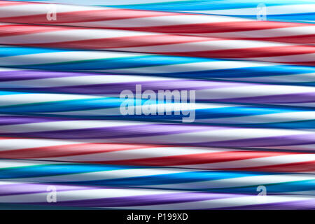 Background of Striped drink straws in different colors Stock Photo