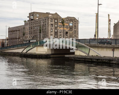 Dublin, Ireland - September 17, 2016: Old warehouse buildings on the Grand Canal Dock in Dublin's regenerating Docklands district. Stock Photo