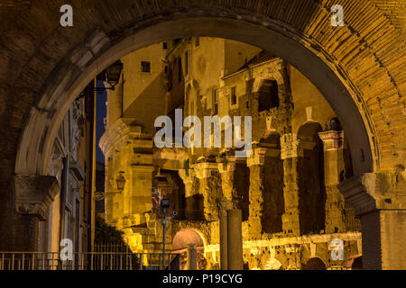 Rome, Italy - March 25, 2018: The ruins of the Roman Porticus Octaviae and the Theatre of Marcellus are lit up at night. Stock Photo