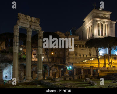 Rome, Italy - March 25, 2018: The Altar of the Fatherland stands on Capitaline Hill behind the ruins of Caesar's Forum in Rome. Stock Photo