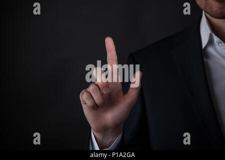 Businessman hand touching virtual screen, modern background concept , copy space for design or text Stock Photo