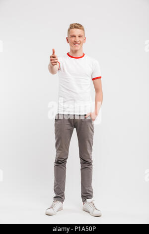 Smiling teenage boy giving thumbs up Stock Photo - Alamy