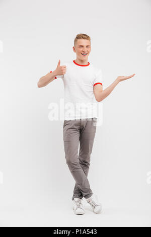 Portrait of a smiling boy giving a thumbs up gesture Stock Photo - Alamy