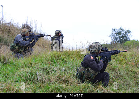 Italian soldiers provide security while role-playing as opposing force during Exercise Allied Spirit V at 7th Army Training Command's Hohenfels Training Area, Germany, Oct. 6, 2016. Exercise Allied Spirit includes about 2,520 participants from eight NATO nations, and exercises tactical interoperability and tests secure communications within Alliance members and partner nations.(U.S. Army photo by Visual Information Specialist Gerhard Seuffert) Stock Photo