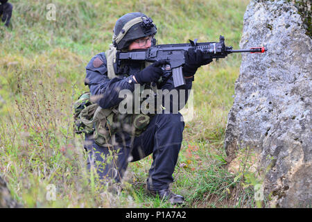 An Italian soldier provides security while role-playing as opposing force during Exercise Allied Spirit V at 7th Army Training Command's Hohenfels Training Area, Germany, Oct. 6, 2016. Exercise Allied Spirit includes about 2,520 participants from eight NATO nations, and exercises tactical interoperability and tests secure communications within Alliance members and partner nations.(U.S. Army photo by Visual Information Specialist Gerhard Seuffert) Stock Photo