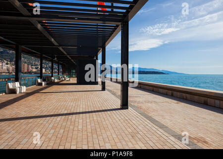 Monaco principality, Esplanade Rainier III, promenade with pergola and pier on Mediterranean Sea, Europe. Stock Photo