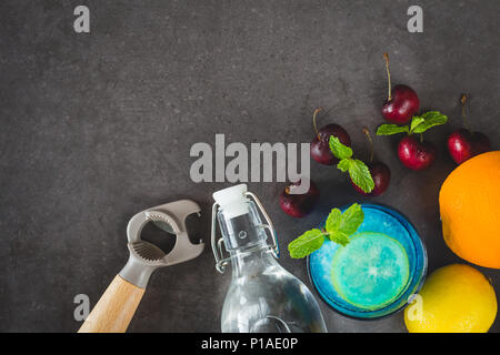 Blue hawaii cocktail on dark stone table. Top view with space for your text Stock Photo
