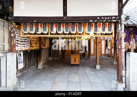 Prayer Lanterns and Wooden Plaques called Ema at the Hozenji Temple, Osaka, Japan. Stock Photo