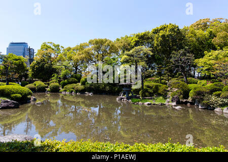 Japanese Garden and Pond inside the grounds of Osaka Castle Stock Photo