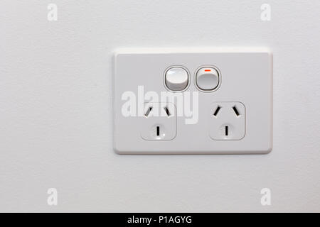 Modern Australia double power outlet on white wall Stock Photo
