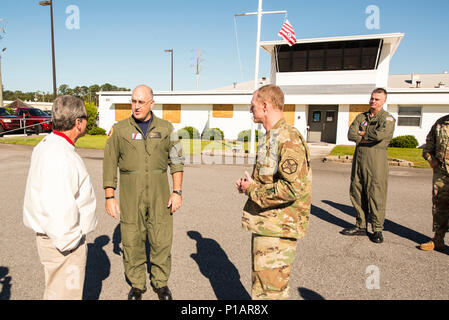 Cmdr. J. Marshall Branch talks with Congressman Buddy Carter and Lt. Col. Michael Squires Oct. 9, 2016 aboard Air Station Savannah. . Coast Guard crews are utilizing Hunter Army Airfield as a forward operating base for Hurricane Matthew response efforts. U.S. Coast Guard photo by Petty Officer 2nd Class Christopher M. Yaw/PADET Jacksonville D7 External Affairs Stock Photo