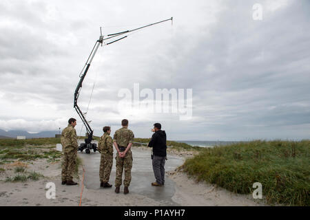 161010-N-JE250-118 BENBECULA, United Kingdom (Oct. 10, 2016) – Bronson Ignacio, an INSITU demonstration team specialist, shows British Royal Air Force personnel an MQ-27A Scan Eagle unmanned aerial vehicle retrieval air hook at Benbecula Rangehead. More than 40 international participants from other navies, industry, academia and research laboratories are in Scotland conducting the first-ever Unmanned Warrior, a research and training exercise designed to test and demonstrate the latest in autonomous naval technologies while simultaneously strengthening international interoperability. Unmanned W Stock Photo