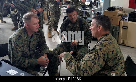 Marine Col. Thomas Prentice, commanding officer of Special Purpose Marine Air-Ground Task Force Southern Command, speaks with Col. Ryan S. Rideout, commanding officer of the 24th Marine Expeditionary Unit about ongoing relief operations in Haiti. JTF Matthew was a U.S. Southern Command lead humanitarian assistance, disaster relief effort in Haiti following Hurricane Matthew. Matthew was a category 4 hurricane that formed in the Western Atlantic Ocean and affected Haiti, eastern Cuba, and the Bahamas before moving up the southeast coast of the United States. (US Marine Corps photo by Staff Sgt. Stock Photo