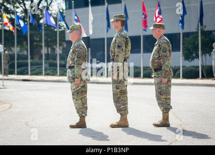 (From left) U.S. Army Reserve Brig. Gen. Christopher R. Kemp, outgoing commander of the 335th Signal Command (Theater), Maj. Gen. David J. Conboy, USAR deputy commanding general, and Brig. Gen. (Promotable) Peter A. Bosse, incoming commander of the 335th, prepare to take the field for a change of command ceremony at Fort McPherson, Ga., Oct. 15, 2016. (U.S. Army photo by Staff Sgt. Ken Scar) Stock Photo