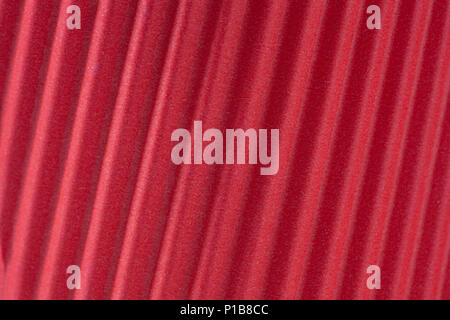 Red corrugated paper background texture closeup Stock Photo
