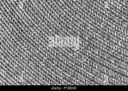 Jute braided home spiral rug background texture pattern - close-up Stock Photo