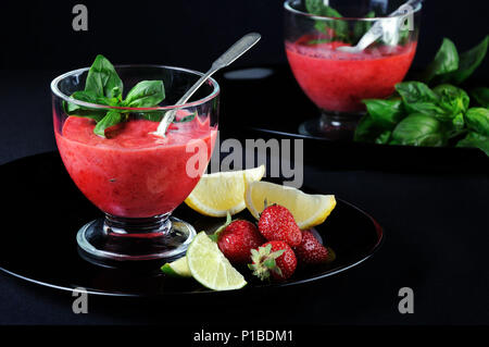 Summer strawberry smoothies with basil, Lime and honey, Healthy and refreshing recipe. A delicious alternative to dessert Stock Photo
