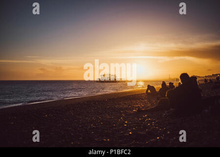 Burned West Pier by the sea, Brighton, England Stock Photo