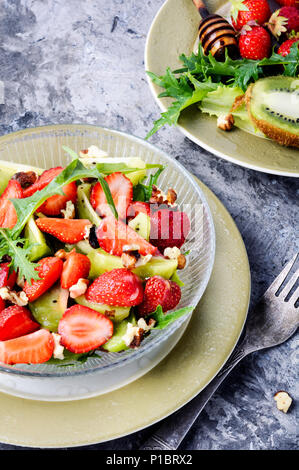 dietary summer salad with strawberries, fruits and lettuce Stock Photo