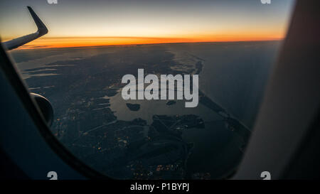 The view at dawn from an airplane window shortly before landing at JFK airport in New York. Stock Photo