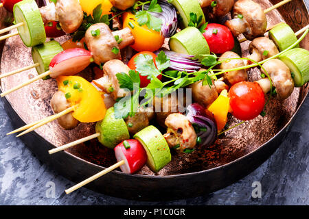 Raw diet kebab from fresh vegetables on skewers. Vegetables for grilling Stock Photo