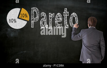 Businessman paints Pareto on blackboard concept. Stock Photo