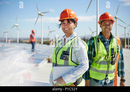 Portrait confident engineers at alternative energy power plant Stock Photo