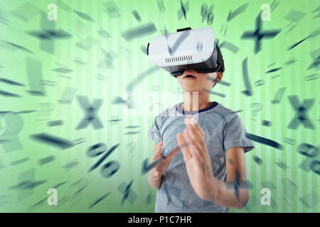 Composite image of boy gesturing while using virtual reality headset Stock Photo