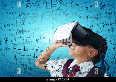 Composite image of close-up of schoolgirl using virtual reality headset Stock Photo