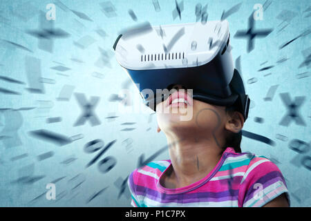 Composite image of close up of girl using virtual reality simulator Stock Photo