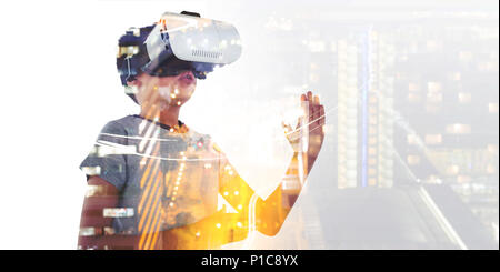 Boy playing using virtual reality headset Stock Photo