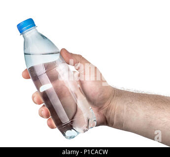 Closed plastic water bottle in hand Stock Photo