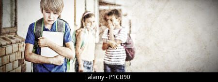 Pupil mocked in the school playground Stock Photo