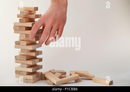 Board game jenga tower of light wood sticks Stock Photo