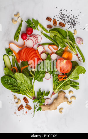 Raw fresh vegetables, fruits, berries, nuts on a white background. Healthy food background. Go vegan concept. Stock Photo