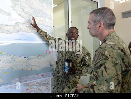 161016-N-VR583-436 PORT-AU-PRINCE, Haiti (Oct. 16, 2016) Rear Adm. Cedric Pringle, commander, Joint Task Force (JTF) Matthew, turns over command of JTF Matthew to Rear Adm. Roy Kitchener, Commander, Expeditionary Strike Group TWO at Toussaint Louveture International Airport.  Joint Task Force Matthew is providing disaster relief and humanitarian aid to Haiti following Hurricane Matthew. (U.S. Navy photo by Petty Officer 3rd Class Gary J. Ward/Released) Stock Photo