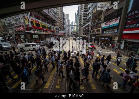 Hong Kong, CHN, China. 27th Apr, 2018. Hong Kong, China .Officially known as the Hong Kong Special Administrative Region of the People's Republic of China. Situated in the Pearl River Delta it is part of the fourth most densely populated region in the world. Currently more than 7.4 million people live in Hong Kong. The area features the most skyscrapers in the world. The city surrounds Victoria Harbour.Street scenes showing public transportation, apartment buildings, pedestrians. Credit: Bill Frakes/ZUMA Wire/Alamy Live News Stock Photo