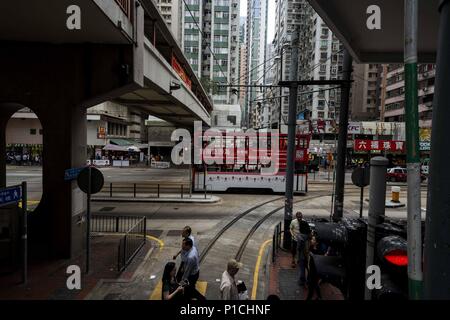 Hong Kong, CHN, China. 27th Apr, 2018. Hong Kong, China .Officially known as the Hong Kong Special Administrative Region of the People's Republic of China. Situated in the Pearl River Delta it is part of the fourth most densely populated region in the world. Currently more than 7.4 million people live in Hong Kong. The area features the most skyscrapers in the world. The city surrounds Victoria Harbour.Street scenes showing public transportation, apartment buildings, pedestrians. Credit: Bill Frakes/ZUMA Wire/Alamy Live News Stock Photo