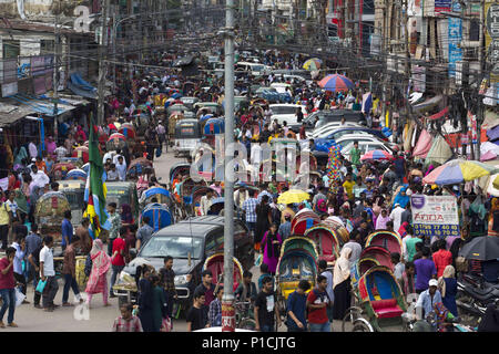 Dhaka, Bangladesh. 11th June, 2018. DHAKA, BANGLADESH - JUNE 12 : Traffic jam and peoples crowd seen at New Market area during the Ramadan in Dhaka, Bangladesh on June 12, 2018.Last 10 years in Dhaka, average traffic speed has dropped from 21 km/hour to 7 km/hour, only slightly above the average walking speed. Congestion in Dhaka eats up 3.2 million working hours per day according to static reports. Credit: Zakir Hossain Chowdhury/ZUMA Wire/Alamy Live News Stock Photo