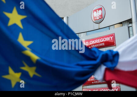 An Eu And Polish Flag Are Seen Next To The Krakow Court During A Protest In Favour Of European Commission Move Urging Eu Leaders To Press Forward With Disciplinary Action Against Poland