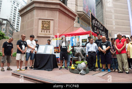 Hong Kong, Hong Kong, China. 12th June, 2018. HONG KONG, HONG KONG SAR, CHINA.JUNE 12th 2018.Representatives from the Hong Kong Alliance in Support of Patriotic Democratic Movements in China, including chairman and human rights lawyer, Albert Ho Chun-yan, unveil a bronze statue of China's Nobel poet laureate Liu Xiaobo in Times Square, Causeway Bay. They have set up an illegal occupation of the area popular with mainland Chinese tourists, intending to stay till the anniversary of the poets death in July.Photo Jayne Russell Credit: Jayne Russell/ZUMA Wire/Alamy Live News Stock Photo
