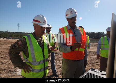 U.S. Army Corps of Engineers Chief of Engineers Lt. Gen. Todd Semonites discusses progress of the Savannah Harbor Expansion Project with Savannah District Construction Project Manager Robert Player during a visit Oct. 13, 2016. Semonite met with key district personnel, state partners and elected officials to discuss progress and reinforce his commitment to delivering one of the most critical projects across USACE. Stock Photo