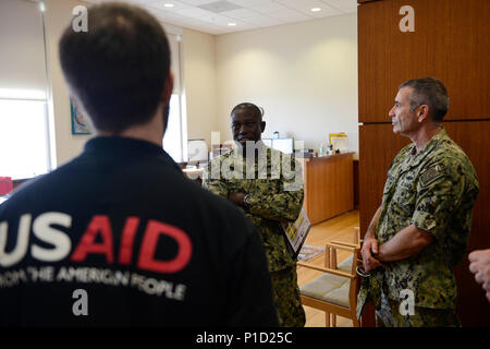 Port au Prince, HAITI (Oct. 14, 2016) – Rear Adm. Cedric Pringle, commander, Joint Task Force Matthew, and Rear Adm. Roy Kitchener, commander, Expeditionary Strike Group Two, meet with U.S. Agency for International Development officials at the American Embassy in Port au Prince. Joint Task Force Matthew is providing disaster relief and humanitarian aid to Haiti following Hurricane Matthew. (U.S. Navy photo by Petty Officer 2nd Class Andrew Murray/Released) Stock Photo
