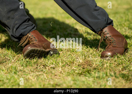 man pulling a rope tug of war. And fight shoes Stock Photo