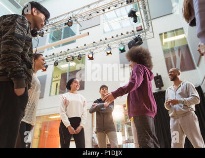 Teenagers talking in dance class studio Stock Photo